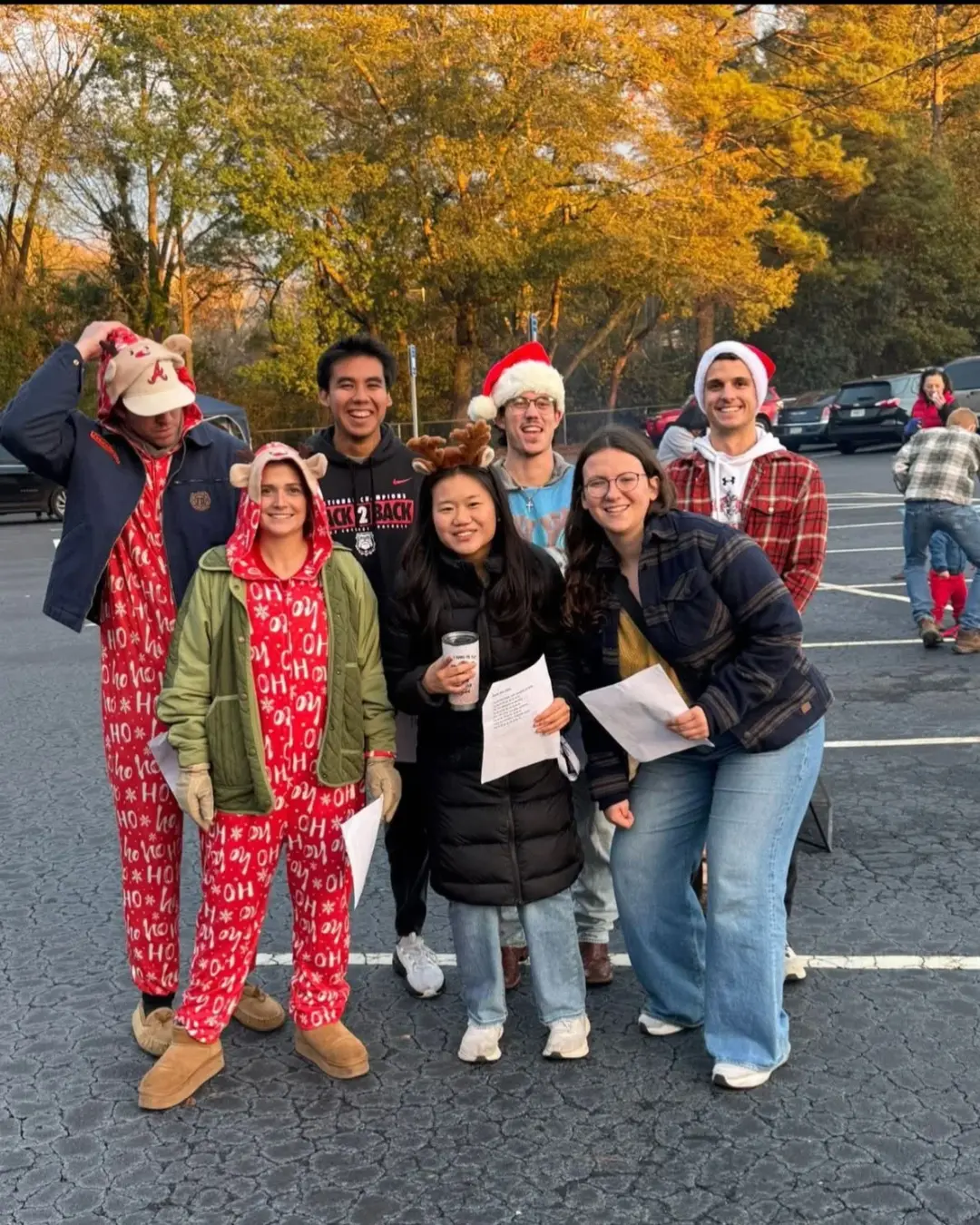 Mercy volunteers in festive hats and Christmas clothing at a patient outreach event